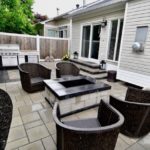 Backyard paver patio with fire pit, step system, and bbq area